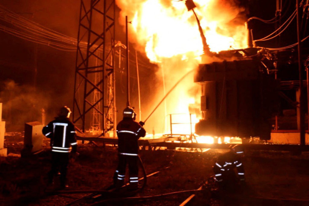 Ukrainian firefighters try to extinguish a fire at a thermal power plant after a Russian attack. Photo: Reuters